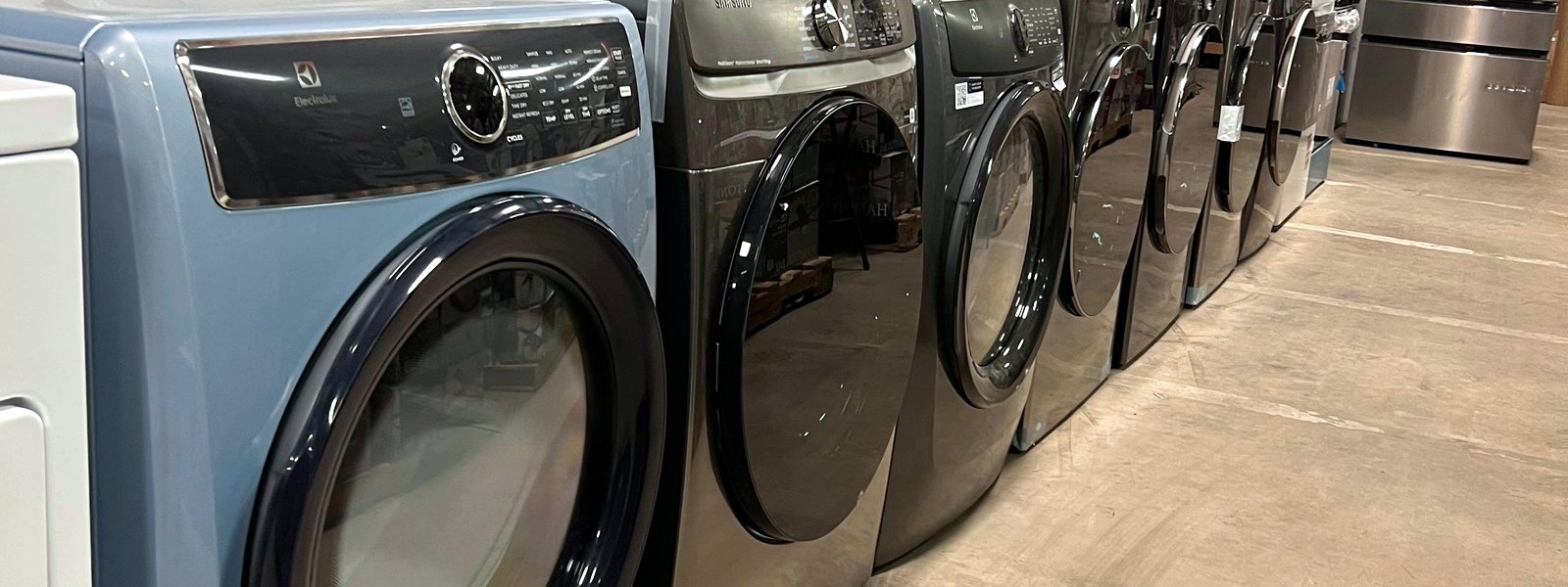 Row of front-load dryers in stock at Warehouse Wonders, Moorhead MN