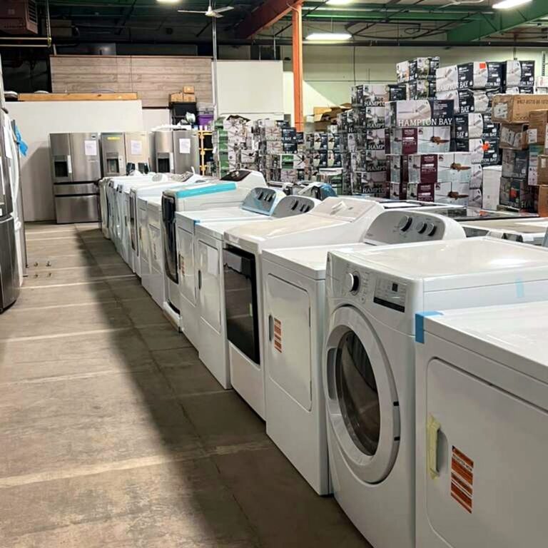 Top-load dryers lined up at Warehouse Wonders warehouse, Moorhead MN
